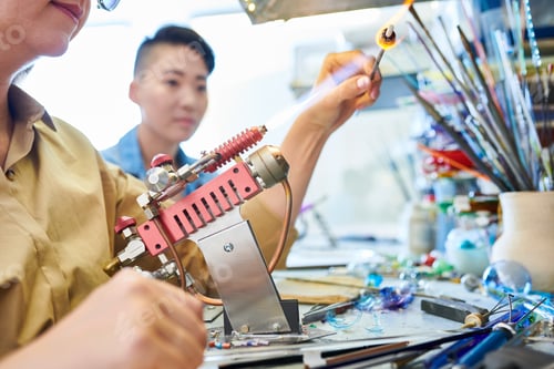 Preview: Female Artist Shaping Glass in Gas Burner