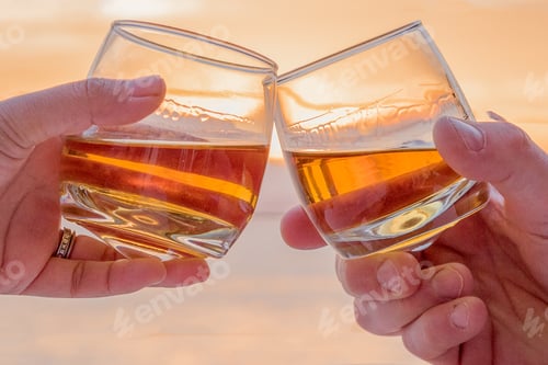 Preview: Close up Toasting whiskey hands.