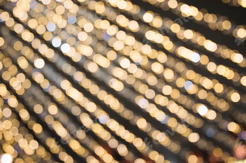 Preview: Blurred garland. City night light blur bokeh, defocused background. Christmas abstract.
