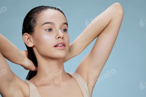 Preview: woman hand near face attractive look blue background
