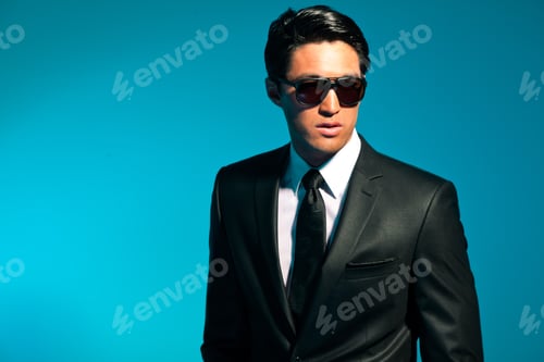 Preview: Asian Man In Suit With Sunglasses. Summer Fashion. Studio.