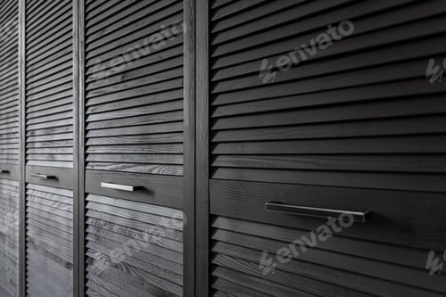 Preview: Close-up of a textured wooden black cabinet.