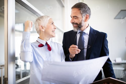 Preview: Business people working discussing as a team at the office