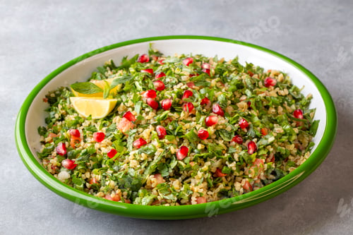 Preview: Traditional Lebanese salad tabouli tabule with quinoa, herbs, tomatoes, mint and lemon.