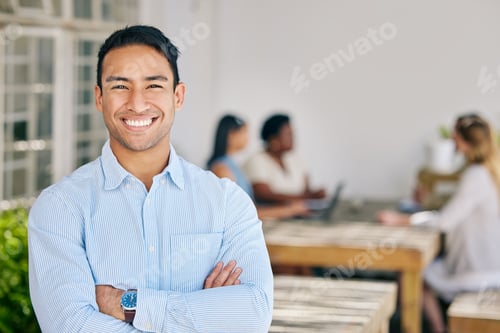 Preview: Motivated, confident and happy business man standing arms crossed in the boardroom for a meeting wi