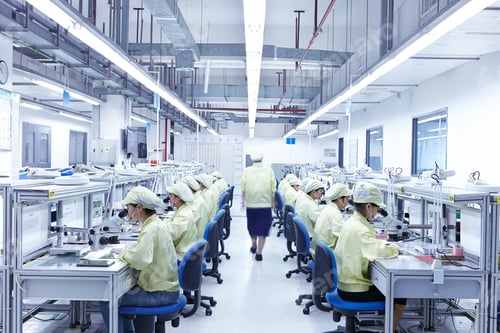 Preview: Supervisor overseeing quality check station at factory producing flexible electronic circuit boards.