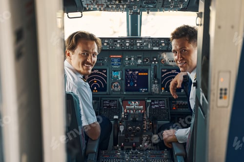 Preview: Joyous pilot and a co-pilot looking out of the cockpit