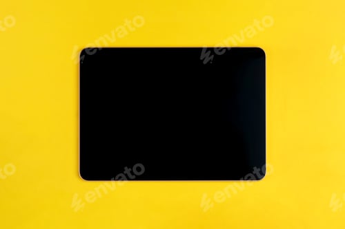 Preview: Digital tablet on yellow background