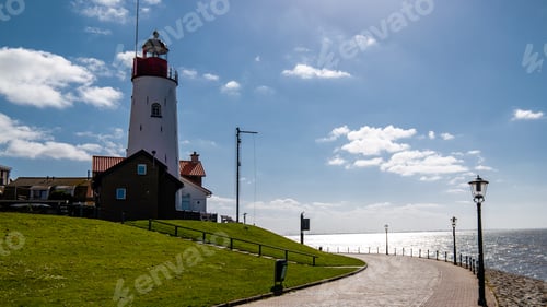 Preview: Urk Flevoland Netherlands sunset at the lighthouse and harbor of Urk Holland