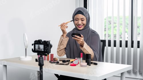 Preview: Asian muslim woman beauty blogger tutorial by eye shadow makeup on her eyes and making videos