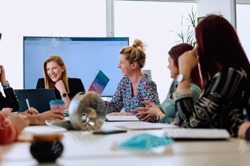Preview: Diverse Business Team Discussing Projects in a Modern Glass Office.