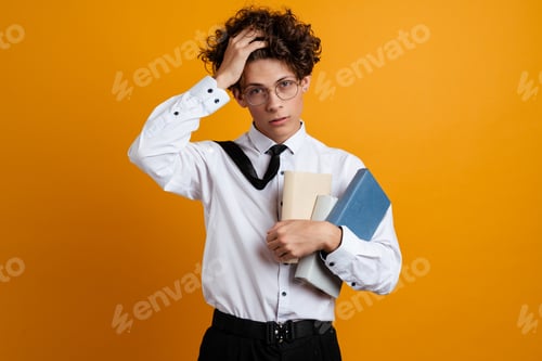 Preview: Sad frustrated college student guy holding books
