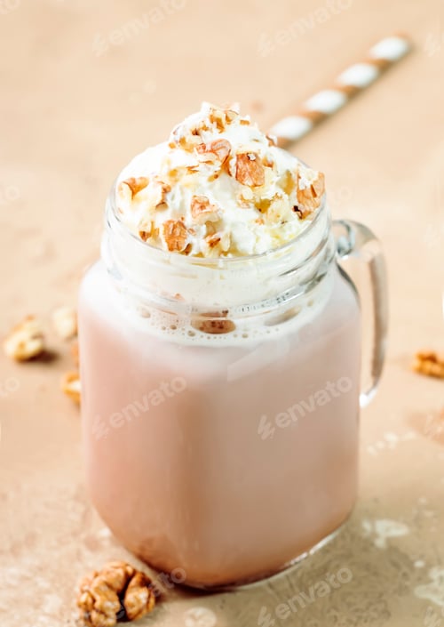 Preview: Winter hot dark chocolate or cocoa drink with whipped cream and crushed walnuts