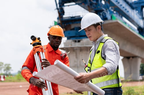 Preview: Surveyors and engineers use a theodolite and plans to measure and check construction.