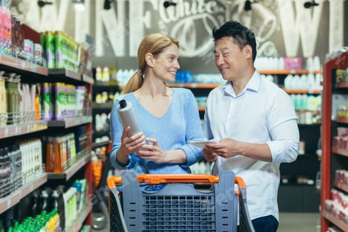 Preview: A young couple, an Asian man and a woman, are together in a supermarket,