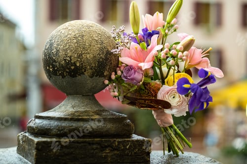 Preview: a wedding bouquet with lilies stands on the street in rainy weather.Wedding Decor