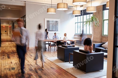 Preview: Business people at work in a busy luxury office space