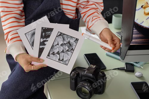 Preview: Close Up of Female Photographer Holding Black White Art Prints