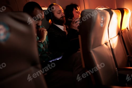 Preview: Diverse passengers flying in economy class with airplane jet