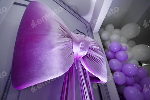 Preview: Large purple bow tie on the wall in the banquet hall.