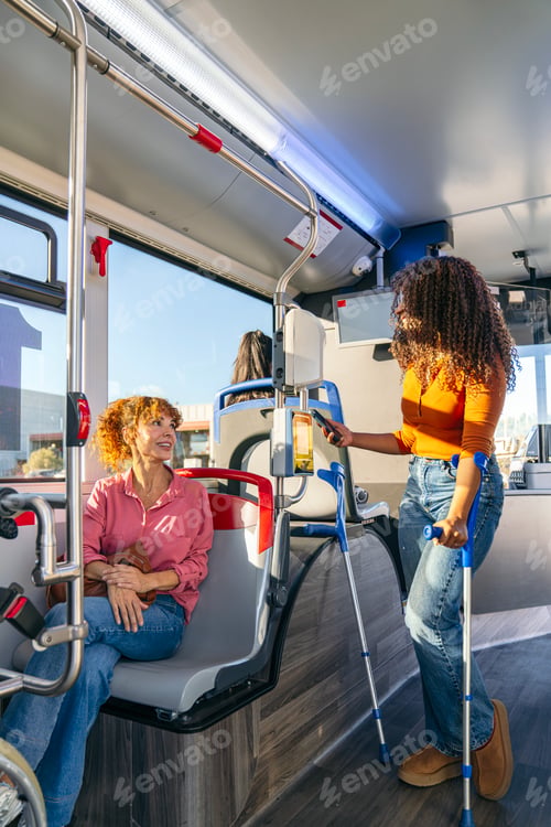 Preview: Woman with crutches using public transport bus