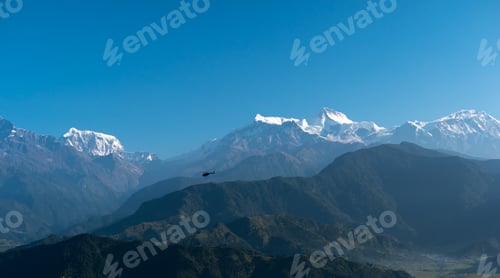 Preview: Helicopter flying among mountains, Pokhara, Nepal.