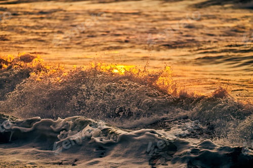 Preview: Atmospheric sea foam at colorful sunset, breathtaking scene of deep sea waves in gold water sparkles