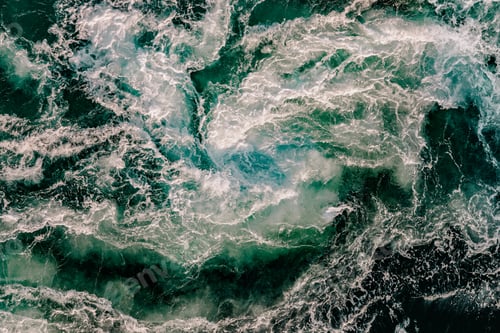 Preview: Blue waves of water of the river and the sea meet each other during high tide and low tide.
