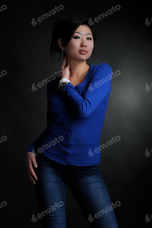 Preview: Asian Woman In Blue Shirt In Studio