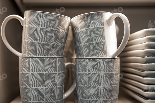 Preview: Cups on the counter of a utensil shop, close-up.