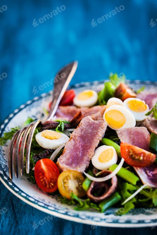 Preview: Tuna salad with tomatoes, boiled eggs, onion, anchovy and lettuc