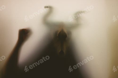 Preview: Horror, halloween background - Shadowy figure with horns behind the glass