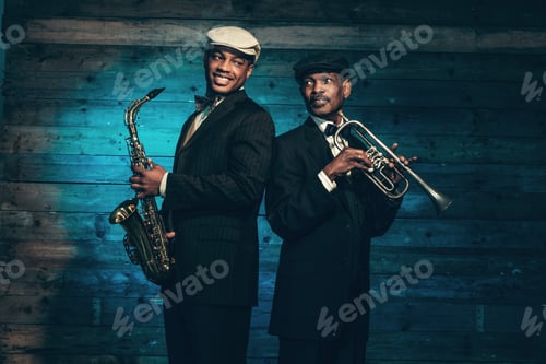 Preview: Two Vintage African American Jazz Musicians With Trumpet And Saxophone In Front Of Old Wooden Wall