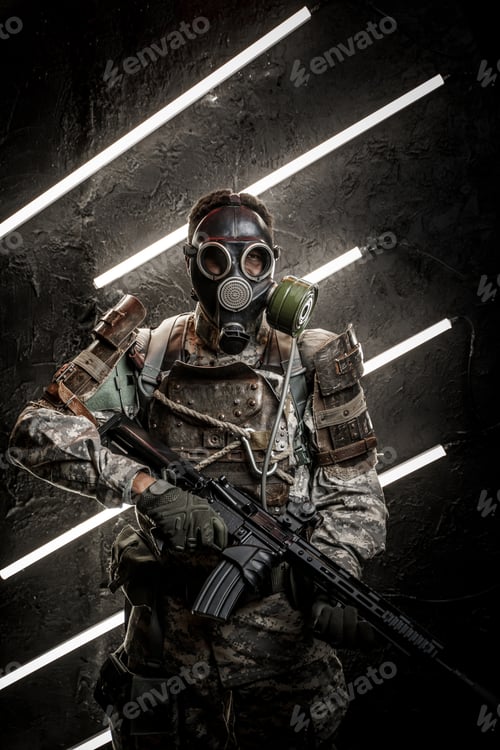 Preview: Dangerous soldier with gas mask against dark background