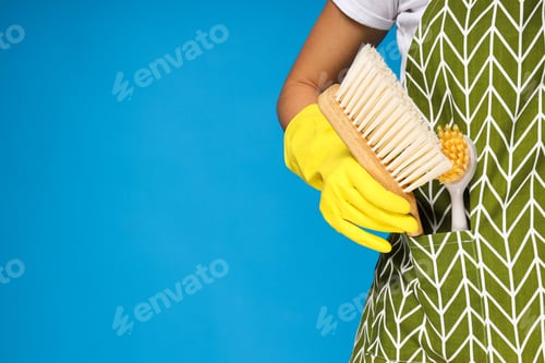 Preview: Cleaning device in pocket on blue background, space for text