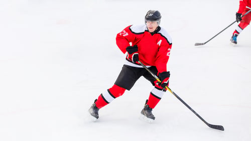 Preview: Professional ice hockey player on defending position on the rink