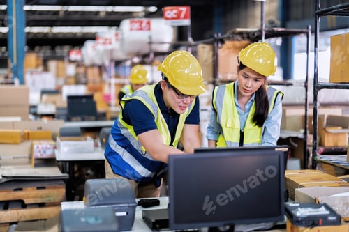 Preview: Staff working in large depot storage warehouse trainee check packing box and scan at cashier counter