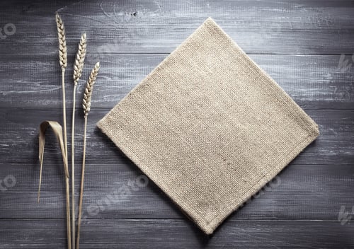Preview: ears of wheat and cloth on wood