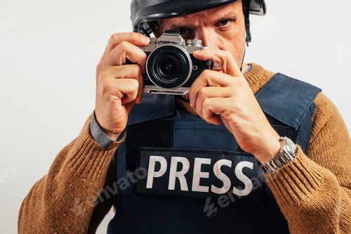 Preview: Reporter in bulletproof vest with a camera.