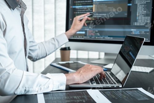 Preview: Professional programmer working on website project in software development on the desktop computer