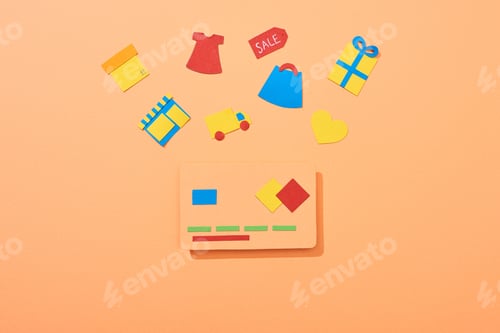 Preview: top view of credit card template near icons on peach background