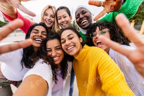 Preview: Multiracial young group of women having fun together taking selfie portrait