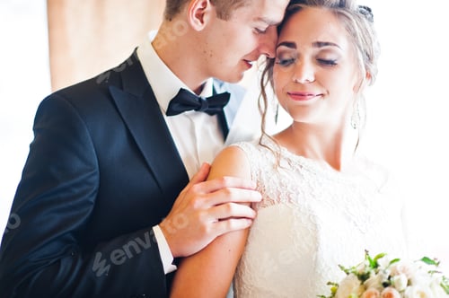 Preview: Close up portrait of wedding couple at gentle touch