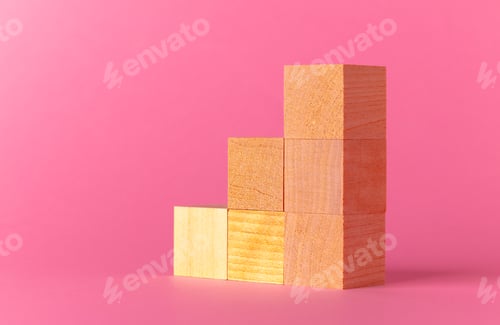 Preview: Toy wooden cubes with copy space against pink background