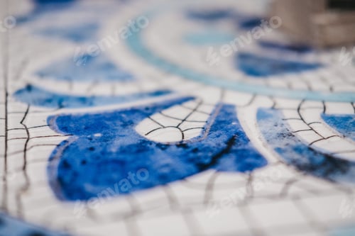 Preview: Selective focus shot of blue mosaic table