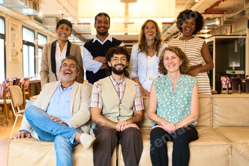 Preview: Diverse business team smiling at modern office