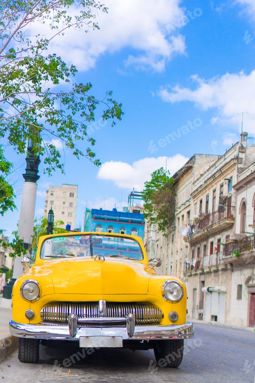 Preview: View of yellow classic vintage car in Old Havana, Cuba