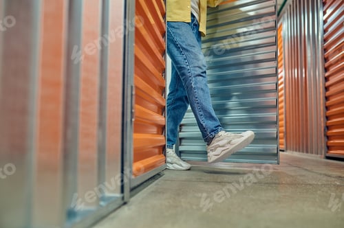 Preview: Legs of man walking out of garage door
