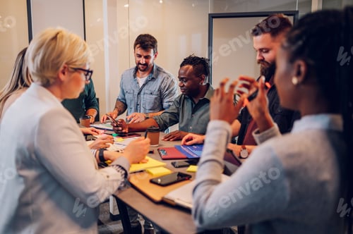 Preview: Multiracial business team working together and having a meeting in the office