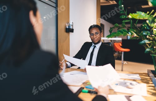 Preview: Multiethnic colleagues working on project in office